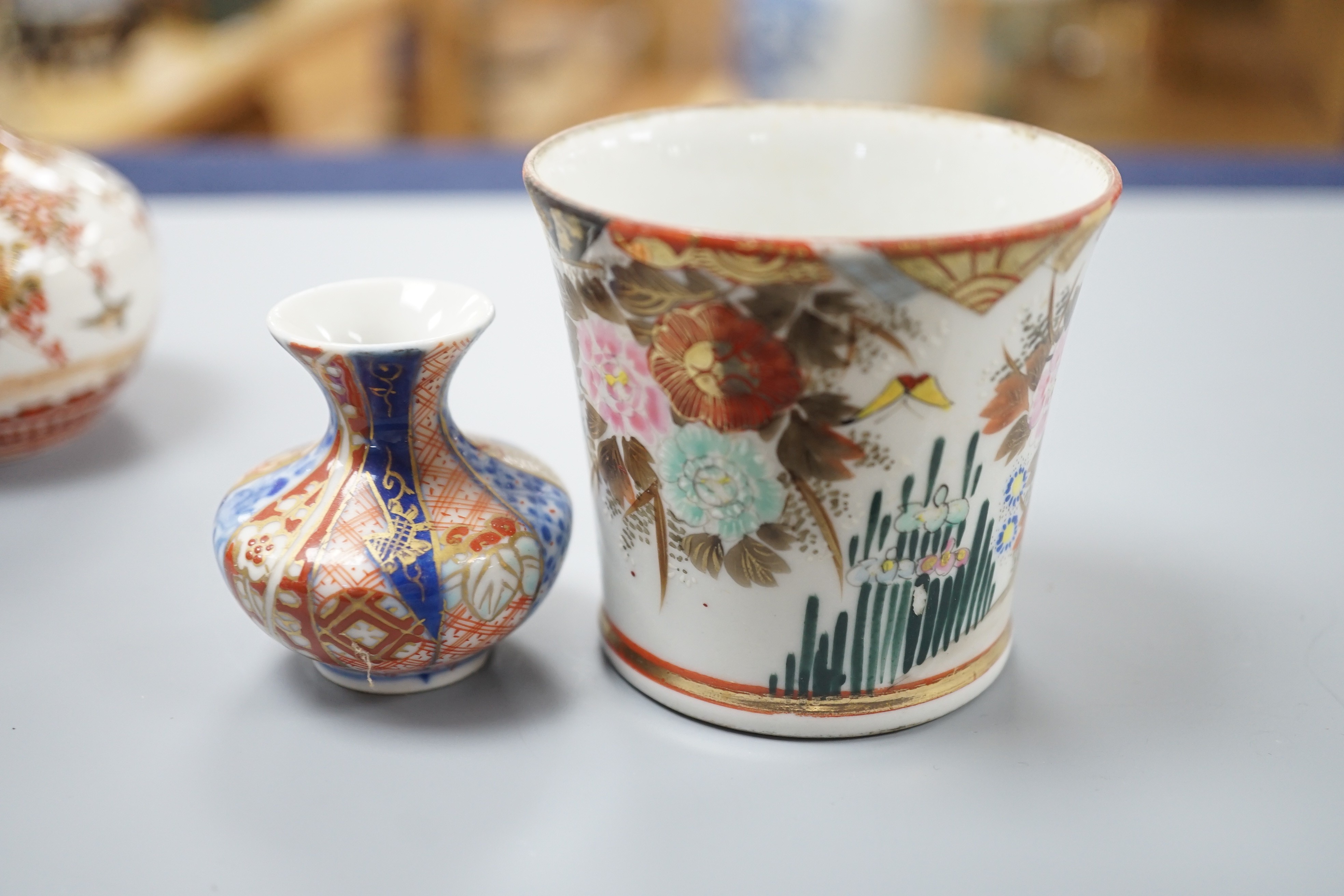 A group of Japanese small or miniature Kutani and Imari vessels and three Satsuma pottery mounted brooches, largest 11.7cm